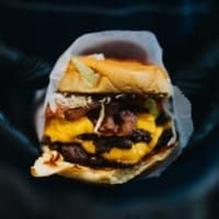 Cheese burger served with crispy fries